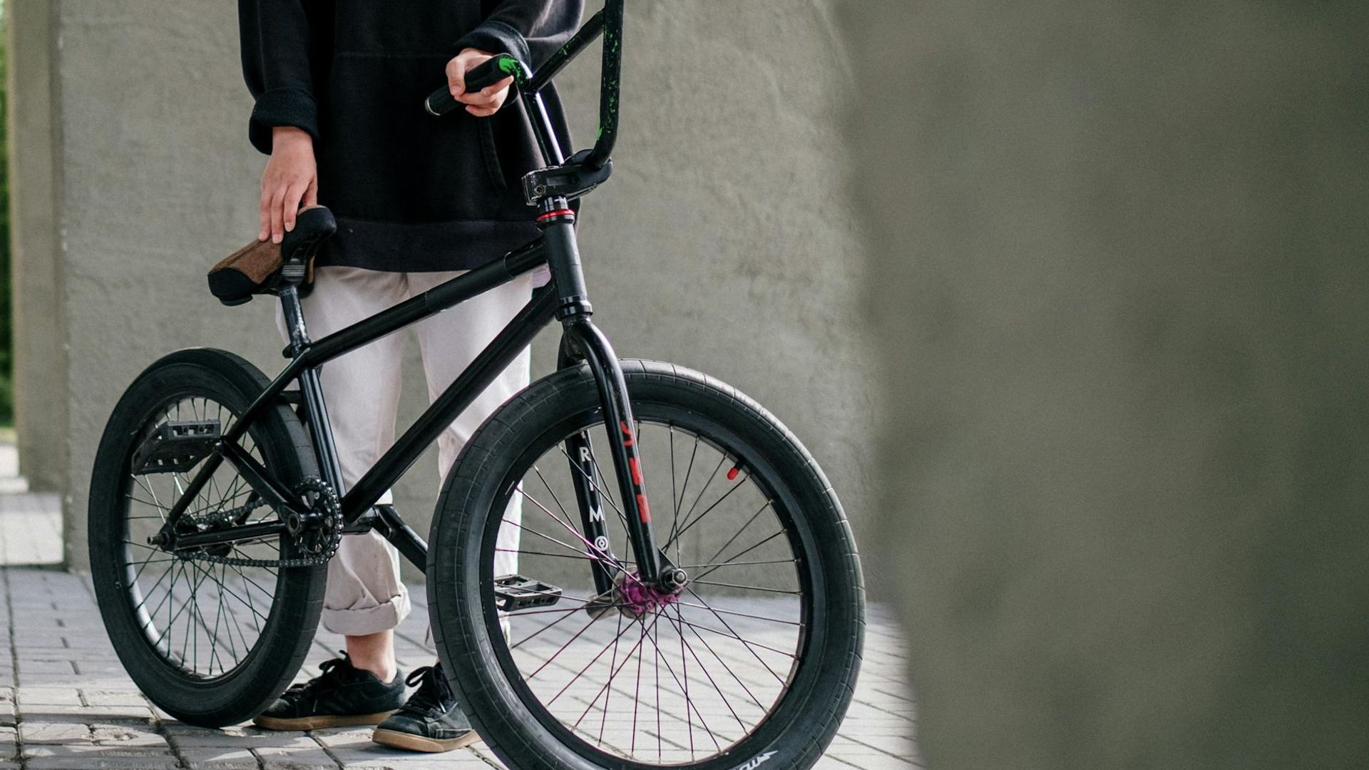 Focused man in athletic stance in a modern, minimalist space.