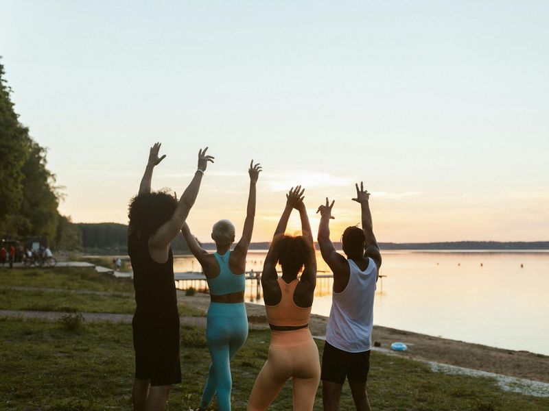 Man in a calm setting preparing for a bodyweight exercise.